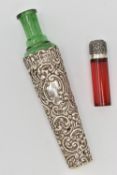 TWO SCENT BOTTLES, the first a green tapering glass bottle with embossed scrolling cover and