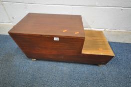 A MID CENTURY TEAK STEPPED SEWING BOX, with a hinged lid, two drawers and contents, raised on