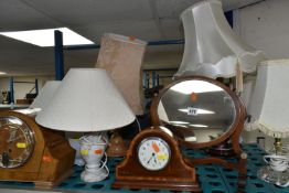 A COLLECTION OF LAMPS, CLOCKS AND A MIRROR, a foreign art deco mantel clock light wood with key, art