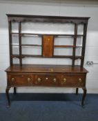 A GEORGIAN OAK DRESSER, the four tier plate rack atop a base that's fitted with three drawers,