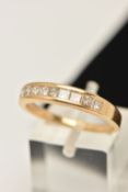 AN 18CT DIAMOND BAND RING, nine princess cut diamonds, channel set in yellow gold, estimated total