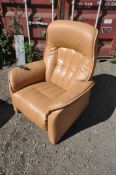 A CARAMEL LEATHER UPHOLSTERED HIMOLLA RECLINING ARMCHAIR, width 88cm x depth 80cm x height 111cm (
