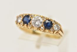 AN 18CT GOLD DIAMOND AND SAPPHIRE RING, set with three graduating round brilliant cut diamonds,