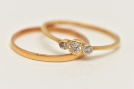 A YELLOW METAL DIAMOND RING AND A THIN BAND RING, set with a central old cut diamond flanked with