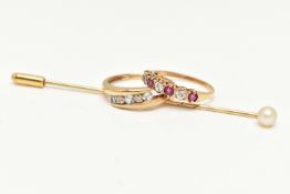TWO 9CT GOLD RINGS AND A STICK PIN, the first a yellow gold aquamarine and diamond bypass ring,