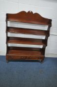 A 19TH CENTURY MAHOGANY FOUR TIER WATERFALL BOOKCASE, with two drawers, raised on turned legs, width