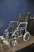 A LIGHTWEIGHT ALUMINIUM 'ANGEL' FOLDING WHEELCHAIR with two footrests