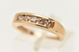 A 9CT GOLD DIAMOND HALF ETERNITY RING, set with five brown round brilliant cut diamonds, estimated