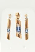 A 9CT GOLD SAPPHIRE PENDANT AND MATCHING EARRINGS, polished bar pendant, set with an oval cut blue