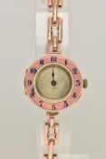 A LADIES 9CT GOLD AND PINK GUILLOCHE ENAMEL WRISTWATCH, manual wind, half hunter style, round dial
