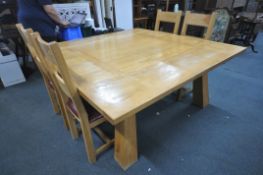 A LARGE SQUARE OAK DINNG TABLE, raised on thick square tapered legs, 180cm squared x height 78cm,