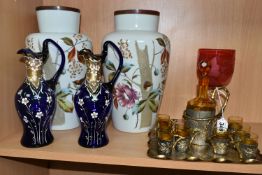 A GROUP OF DECORATIVE GLASSWARE, comprising a nine piece amber glass liqueur set, with handles in