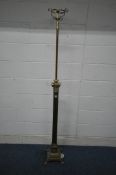 A BRASS CORINTHIAN STYLE TELESCOPIC STANDARD LAMP, raised on a stepped base and four feet, maximum