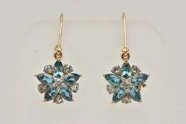 A PAIR OF YELLOW METAL BLUE TOPAZ FLOWER DROP EARRINGS, fish hook fittings, stamped 9k, drop