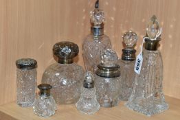 EIGHT GLASS SCENT BOTTLES, with silver collars or covers, comprising a square based scent bottle,