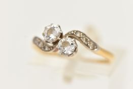 A YELLOW METAL DIAMOND RING, set with two old cut diamonds, each in an eight claw setting, estimated