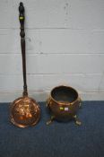 A COPPER LOG BIN, with twin brass lion mask handles, raised on three brass legs, approximate