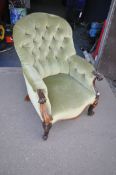 A VICTORIAN ROSEWOOD BUTTONED SPOONBACK CHAIR, with swept armrests, on front cabriole legs, width