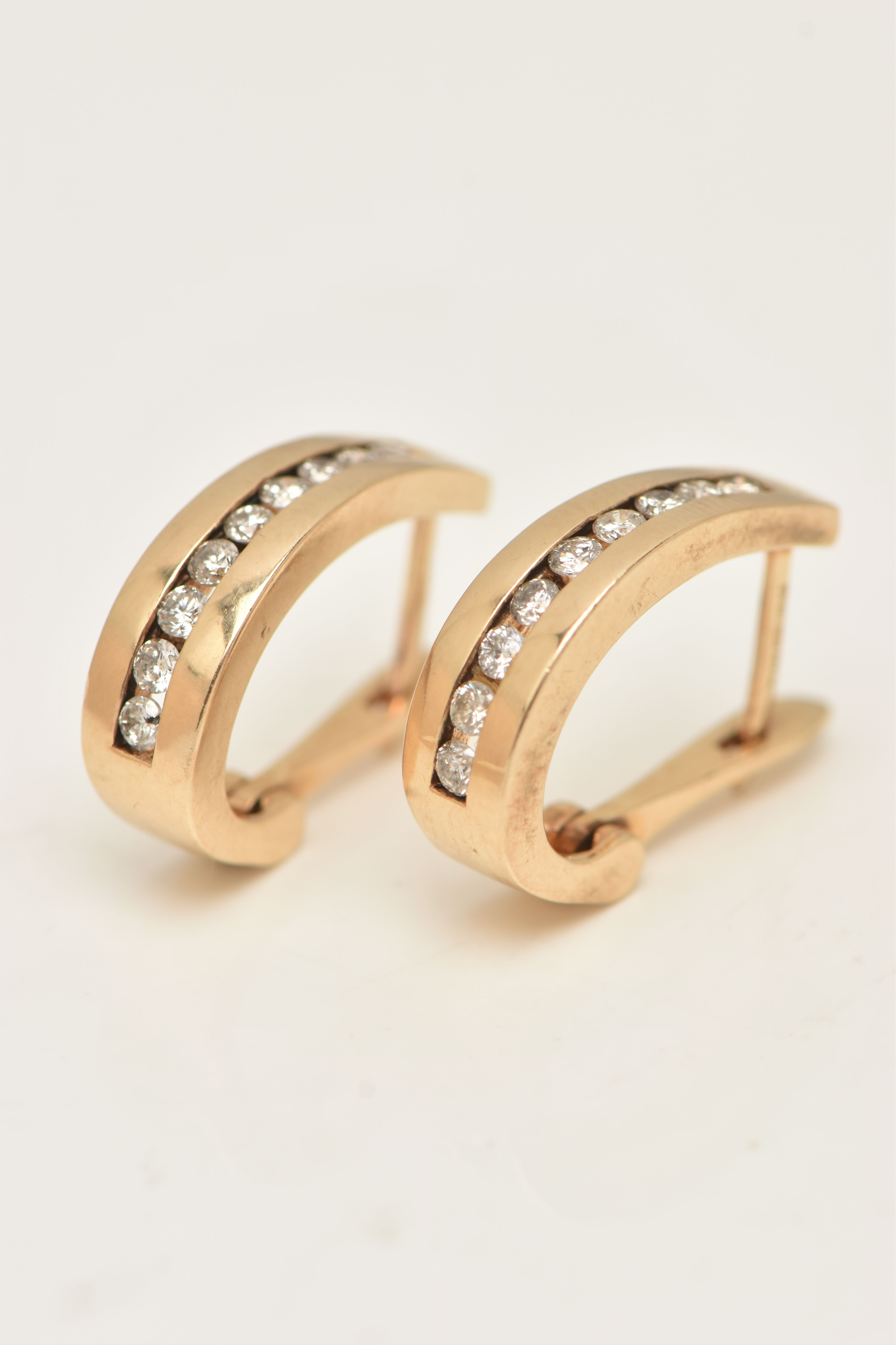 A PAIR OF 9CT GOLD DIAMOND HOOP EARRINGS, yellow gold half hoop, channel set with round brilliant - Image 2 of 5