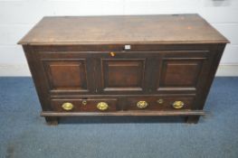 A GEORGIAN OAK COFFER, with a hinged lid enclosing a candle box, two drawers, width 133cm x depth