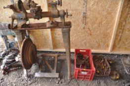 A VINTAGE DRUMMOND BROTHERS TREADLE LATHE with two trays containing tools and parts including a