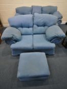 A LIGHT BLUE THREE PIECE LOUNGE SUITE, comprising a three seater sofa, length x depth x height, a