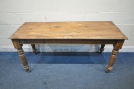 AN EDWARDIAN MAHOGANY RECTANGULAR TABLE, raised on turned legs and ceramic castors, length 153cm x