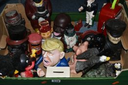 A BOX OF NOVELTY MONEY BOXES, to include cast iron examples of different ages, including boxes in