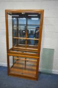 A MODERN DISPLAY CABINET, with four glass doors, enclosing four glass shelves, width 101cm x depth
