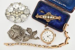 A 9CT GOLD WATCH AND THREE BROOCHES, an early 20th century hand wound movement, round dial, Roman