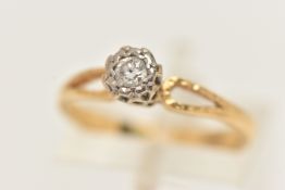 A YELLOW METAL DIAMOND SINGLE STONE RING, the round brilliant cut diamond, illusion set in a white