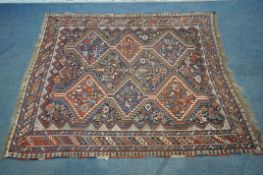 A LATE 19TH CENTURY QASHKAI HAND WOVEN WOOL RUG, with six medallions, repeating geometric designs,