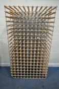 A LARGE WOOD AND METAL WINE RACK, with 220 sections, width 108cm x depth 54cm x height 193cm (