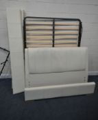 A CREAM LEATHER 5FT BEDSTEAD, the slats with a hinged mechanism (condition report: stains,