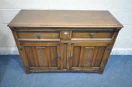 A 20TH CENTURY OAK SIDEBOARD, fitted with two drawers, above double cupboard doors, length 122cm x