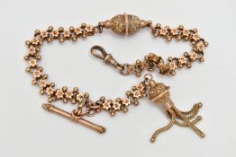A YELLOW METAL ALBERTINA, a fancy link chain with punched star detail to the links, fitted with a