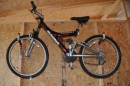 A MAGNA TORSION MOUNTAIN BIKE with 15speed Falcon twist grip gears, 15in frame