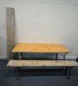 A PINE TOP RECTANGULAR TABLE, with folding metal legs, length 179cm x depth 67cm x height 74cm,