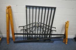 A MODERN 4FT6 WOOD AND TUBULAR METAL BEDSTEAD, with side rails metal slats and bolts (condition