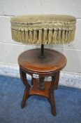 A 20TH CENTURY MAHOGANY SWIVEL PIANO STOOL, the circular stool with green upholstery, raised on four