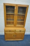 LUCIAN ERCOLANI, A MID CENTURY ELM AND BEECH DISPLAY CABINET, the double bevelled glass doors