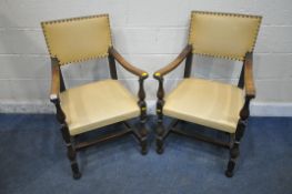 A PAIR OF 20TH CENTURY OAK CHAIRS, with swept open armrests, turned legs and supports, united by