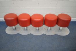A SET OF FIVE RED VINYL INTERCONNECTING STOOLS, raised on chrome bases, diameter 60cm x height