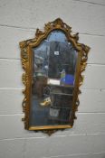 A FLAMBOYANT GILT RESIN BEVELLED EDGE WALL MIRROR, 57cm x 99cm (condition report: damages and