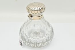 A LARGE EDWARDIAN SCENT BOTTLE, a cut crystal tear shaped bottle with a hinged silverplate lid,