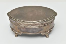 AN ELIZABETH II SILVER TRINKET BOX, oval form box, raised on four scrolling feet, lined with read