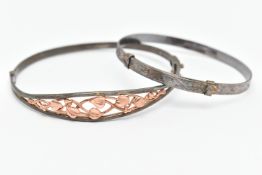A 'CLOGAU' TREE OF LIFE BRACELET, a silver hinged bangle with open work rose metal foliage detail,