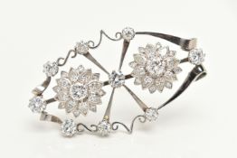 AN 18CT WHITE GOLD AND DIAMOND PENDANT BROOCH, designed as an open work navette form brooch,