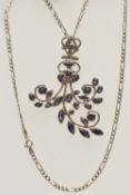 A LARGE WHITE METAL GEM SET PENDANT WITH CHAIN, the large open work floral pendant set with