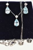 A WHITE METAL NECKLACE AND EARRING SET, a pear cut blue topaz, set with a single circular cut